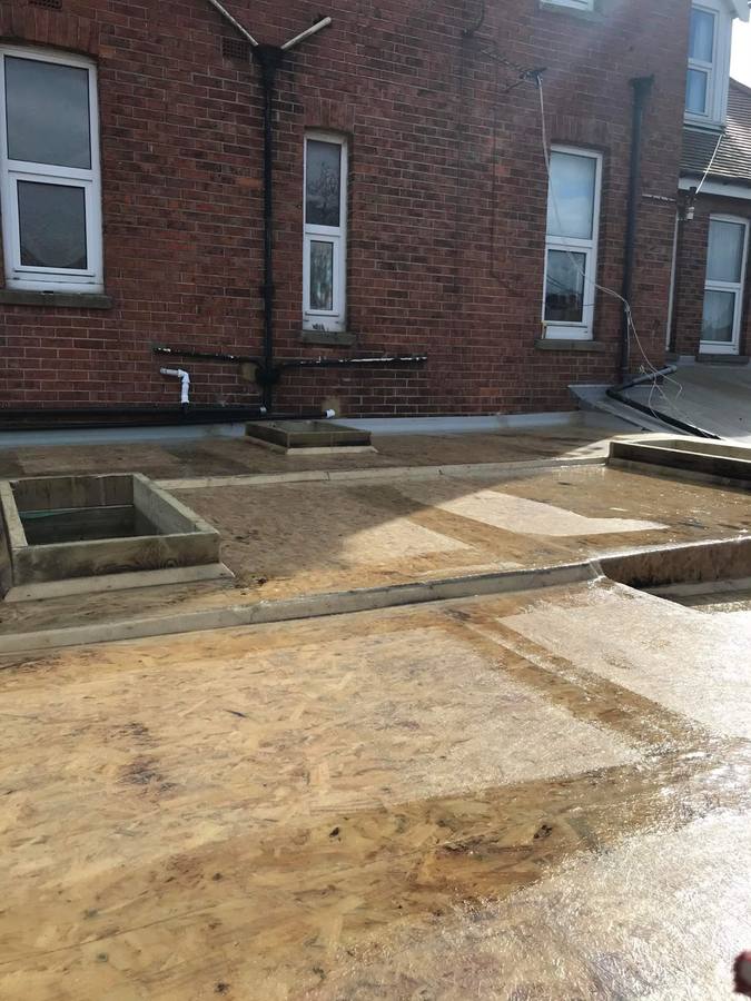 Flat roof stripped back to new OSB decking
